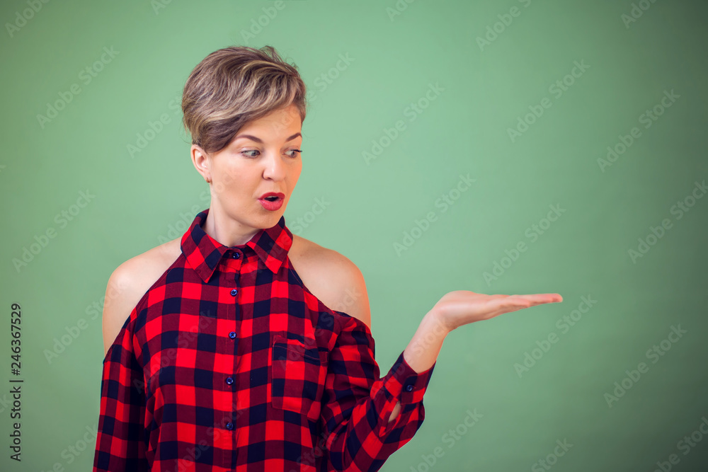 People and emotions -a portrait wondering woman holding something on her hand