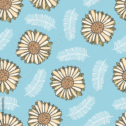Bright summer floral seamless pattern with yellow gerbera flowers and white leaves on blue background. Trendy hand drawn plants texture for textile, wrapping paper, surface, wallpaper