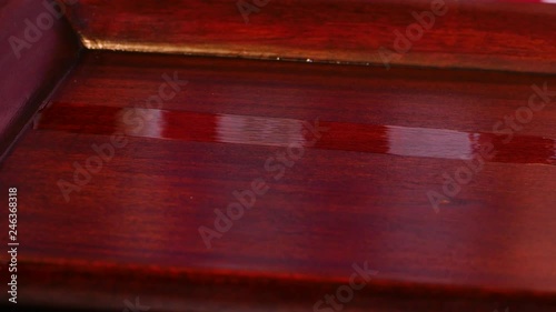Applying Varnish To Mahogany Table With Foam Brush 