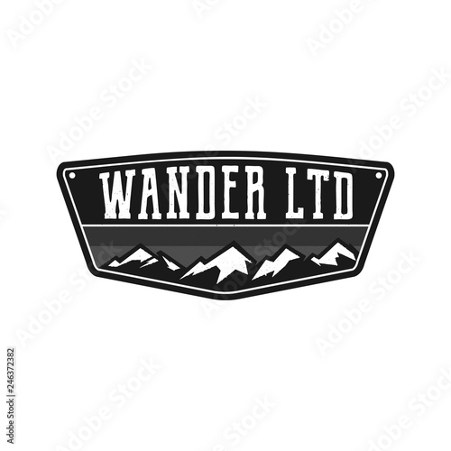 Mountain Illustration, outdoor adventure logo badge. Wander LTD text. Vintage hand drawn camping emblem in monochrome style. Stock vector label isolated on white background