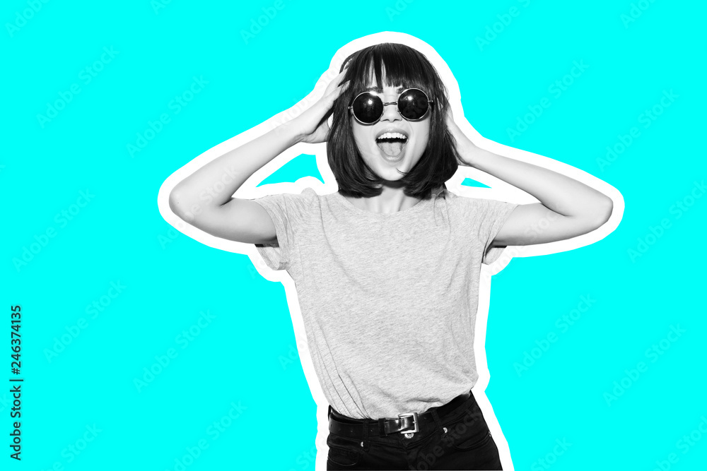 Collage in magazine style with colorful emotional fashion girl in t-shirt and sunglasses scream holding her head toned blue background Collage in magazine style with colorful emotional fashion girl in t-shirt and sunglasses scream holding her head toned blue background