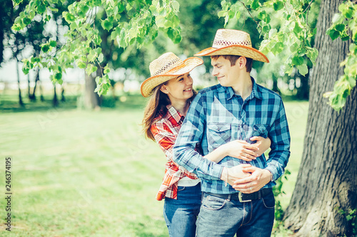 Happy young couple in love outdoors on picnic having a good leisure vacation together in cowboy style © Andreshkova Nastya