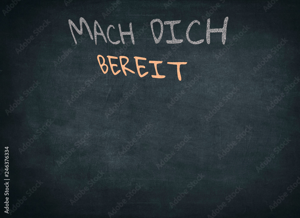 Fototapeta premium Conceptual Get Ready (Mach dich bereit) Message in German Texts Written on Black Chalkboard