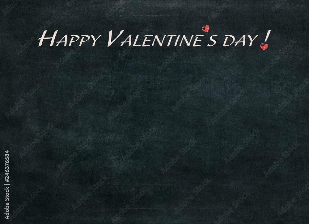 Fototapeta premium Happy Valentine's day written chalk on a blackboard