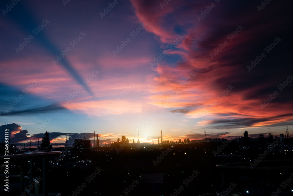 silhouette factory with dramatic sky background,petrochemical plant area with beautify sky at sunset.