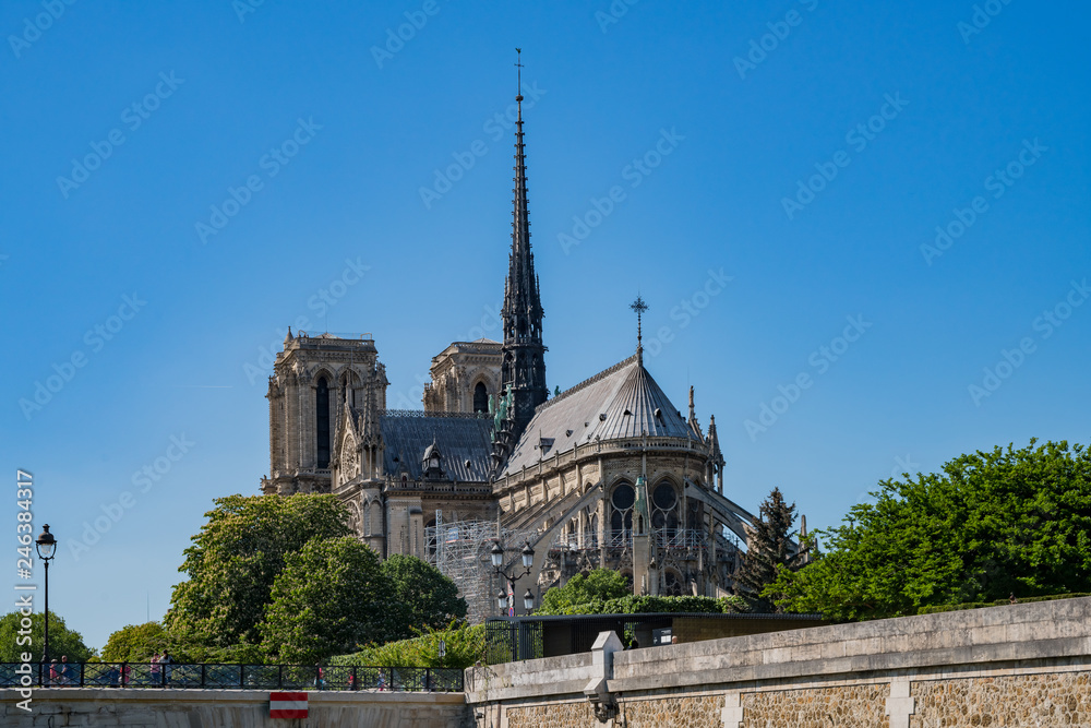 Exterior view of the famous Notre-Dame Cathedral via the rivier