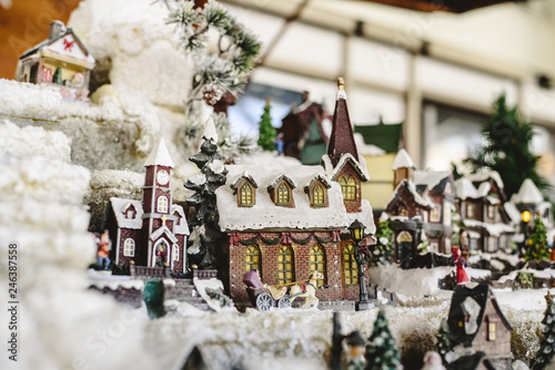 Figures and Christmas decorations in Nordic style  miniature houses with a snowy village.