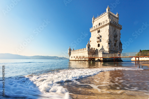 Lisbon. The magnificent Belem Tower in Manueline style on the background of the Tejo River in the sunset light (Torre de Belem)