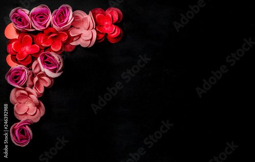 Frame of flowers on black background. Valentine   s Day. Greeting card. Flatlay