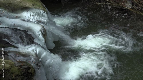 Schiessentuempel Waterfall near Mullerthal in Mullerthal Valley in winter, Echternach, Luxembourg, Europe photo