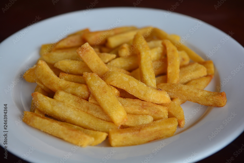 Close up French fries on white plate. food Close up French fries on white plate. food