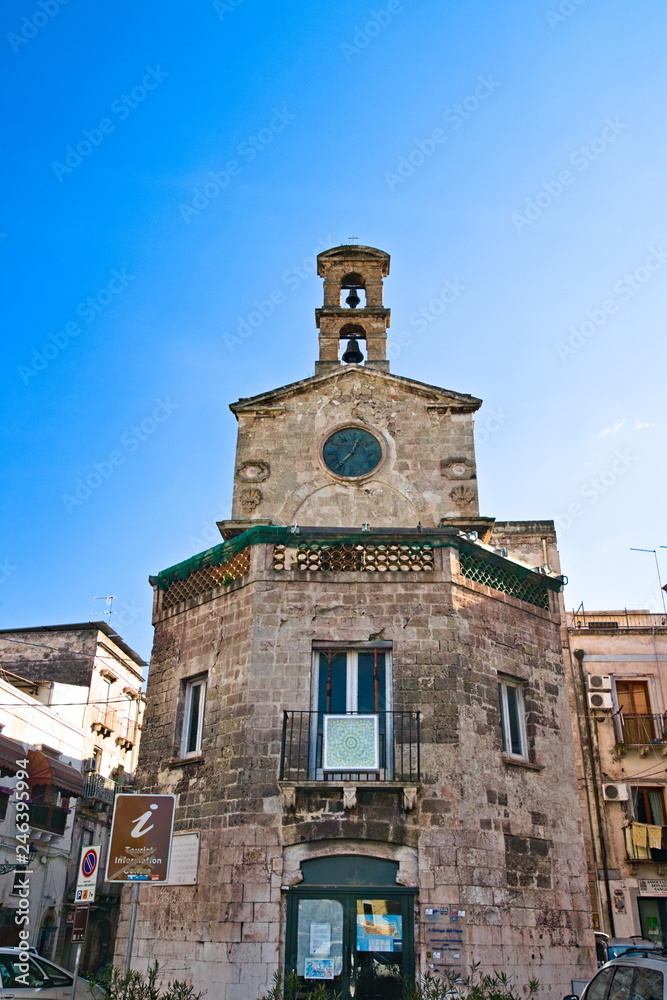 Old clock tower in the old town of Taranto, Puglia, Italy