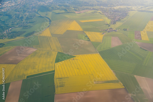 Aerial view of France rural landscape with some Canola flower blossom