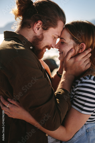 Фотография Loving couple caught in romantic moment