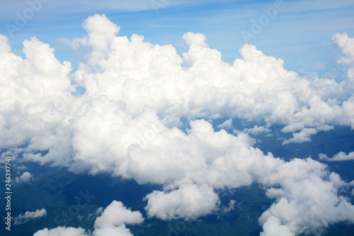Aerial view Clouds and sky as seen through window of an aircraft
