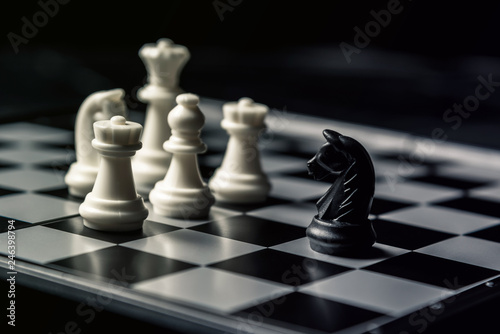 Chess board. The black horse threatens the opponent's white chess.
