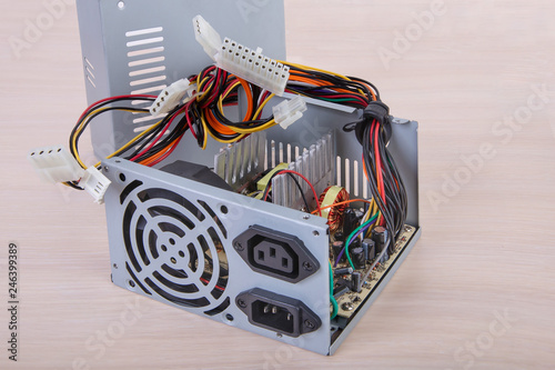Computer power supply.Gray PCU.Inside view.PC component.