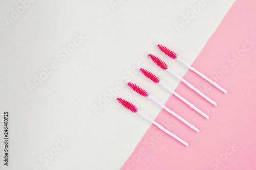 Beauty of eyelashes and eyebrows: eyelash extension tools and decor on white background with copy space. top view. Flatley