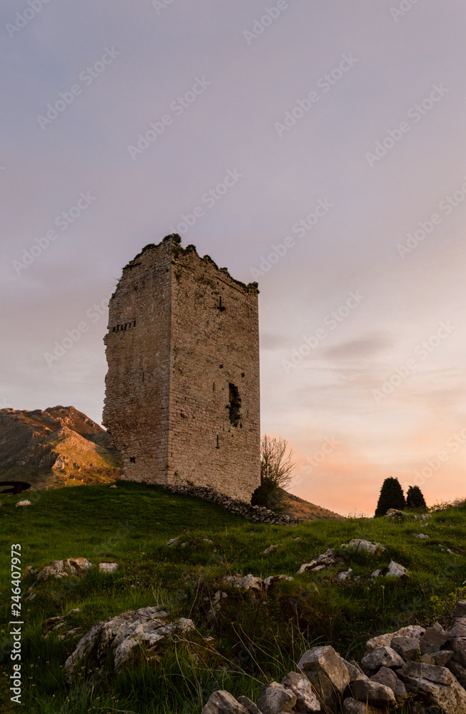 Popular tourist attraction site: Ruins of a medieval tower castle of XII century. Asturias. Spain.