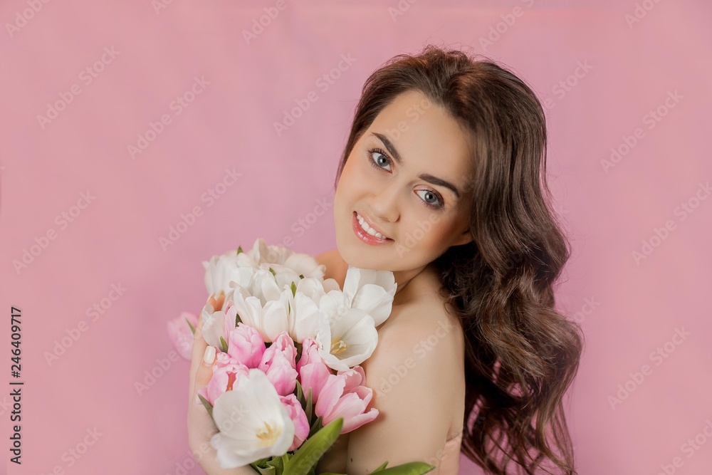 Young woman Bouquet of Tulips Smiling Girl Portrait Spring Pink background Holidays Young woman Bouquet of Tulips Smiling Girl Portrait Spring Pink background Holidays