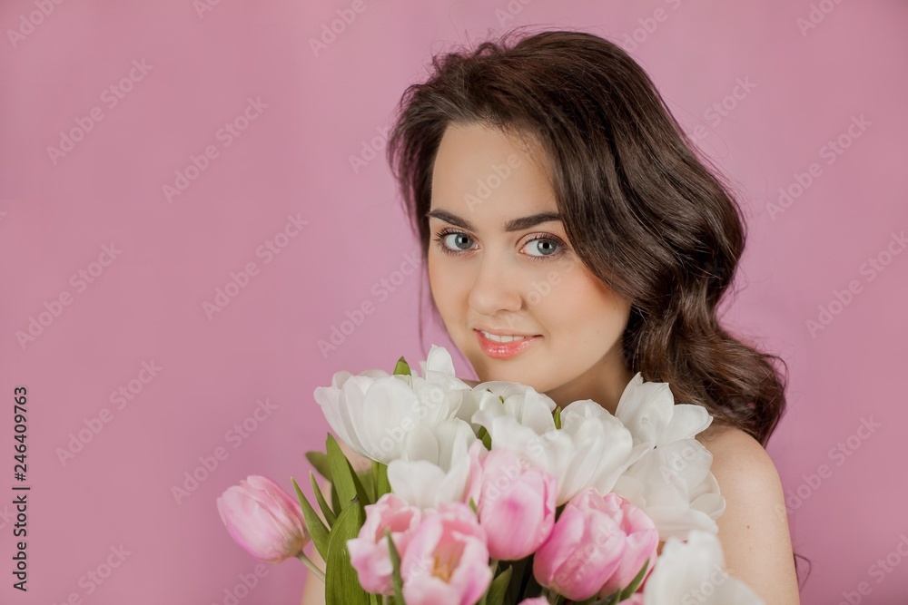 Young woman Bouquet of Tulips Smiling Girl Portrait Spring Pink background Holidays Young woman Bouquet of Tulips Smiling Girl Portrait Spring Pink background Holidays