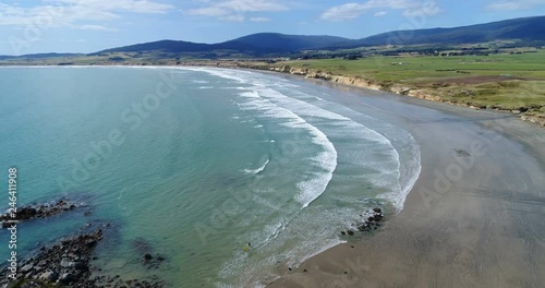 New Zealand aerial drone footage of coast and beach nature landscape at Te Waewae Bay by Orepuki in the Southland region of the south island of New Zealand. photo