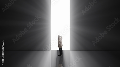 Lonely man standing in front of the huge gate