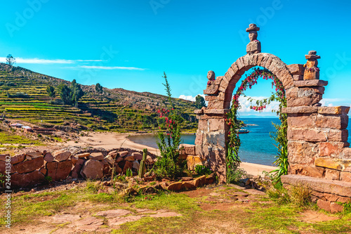 Entrance stone arch leading to the interior of Taquile Island in Lake Titicaca, Peru.