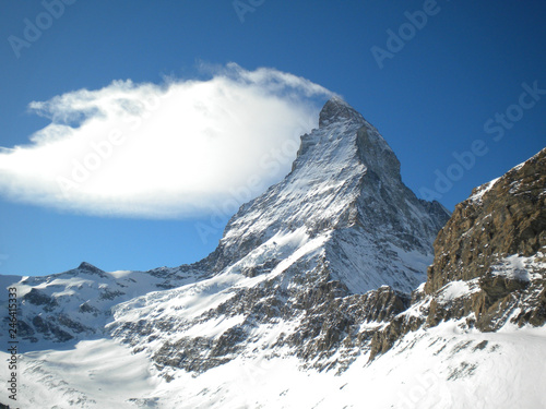 Fototapeta Naklejka Na Ścianę i Meble -  The Matterhorn with a cloud as a hat