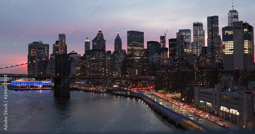 View from above of the Brooklyn Bridge, traffic in the FDR highway and the lower Manhattan skyline in the Financial District of New York City, NY. View from above of the Brooklyn Bridge, traffic in the FDR highway and the lower Manhattan skyline in the Financial District of New York City, NY.