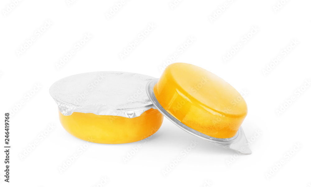 Glass jar and honey dripping from dipper isolated on white background Glass jar and honey dripping from dipper isolated on white background