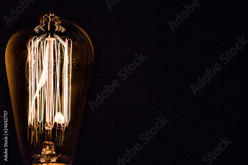 Light bulb closeup with black background isolated