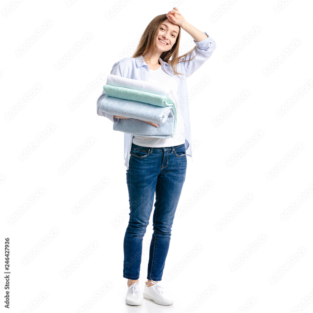 Woman in jeans and blue shirt towels in hand on white background isolation Woman in jeans and blue shirt towels in hand on white background isolation