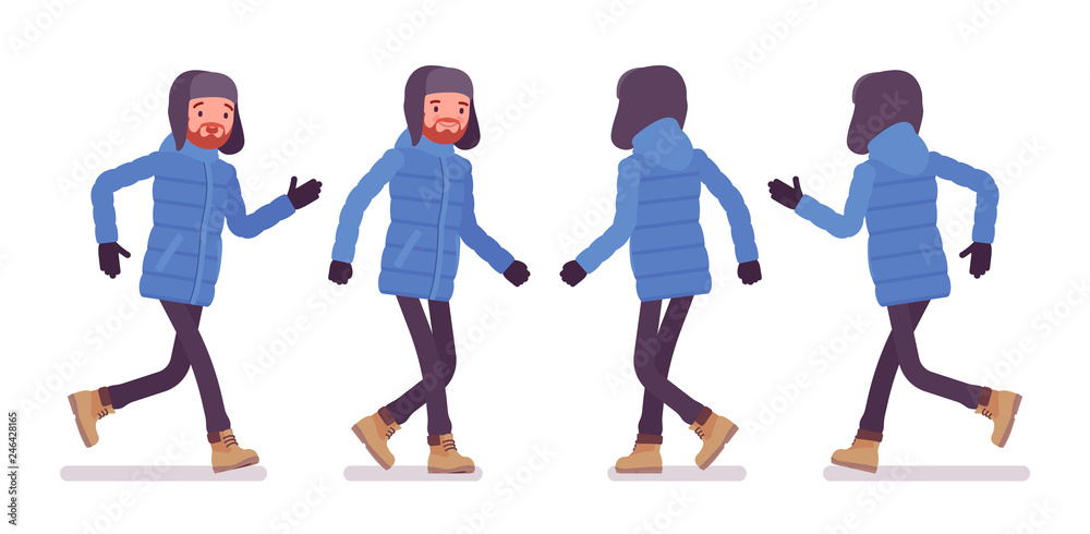 Stylish man in a blue down jacket walking