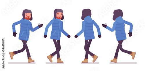 Stylish man in a blue down jacket walking