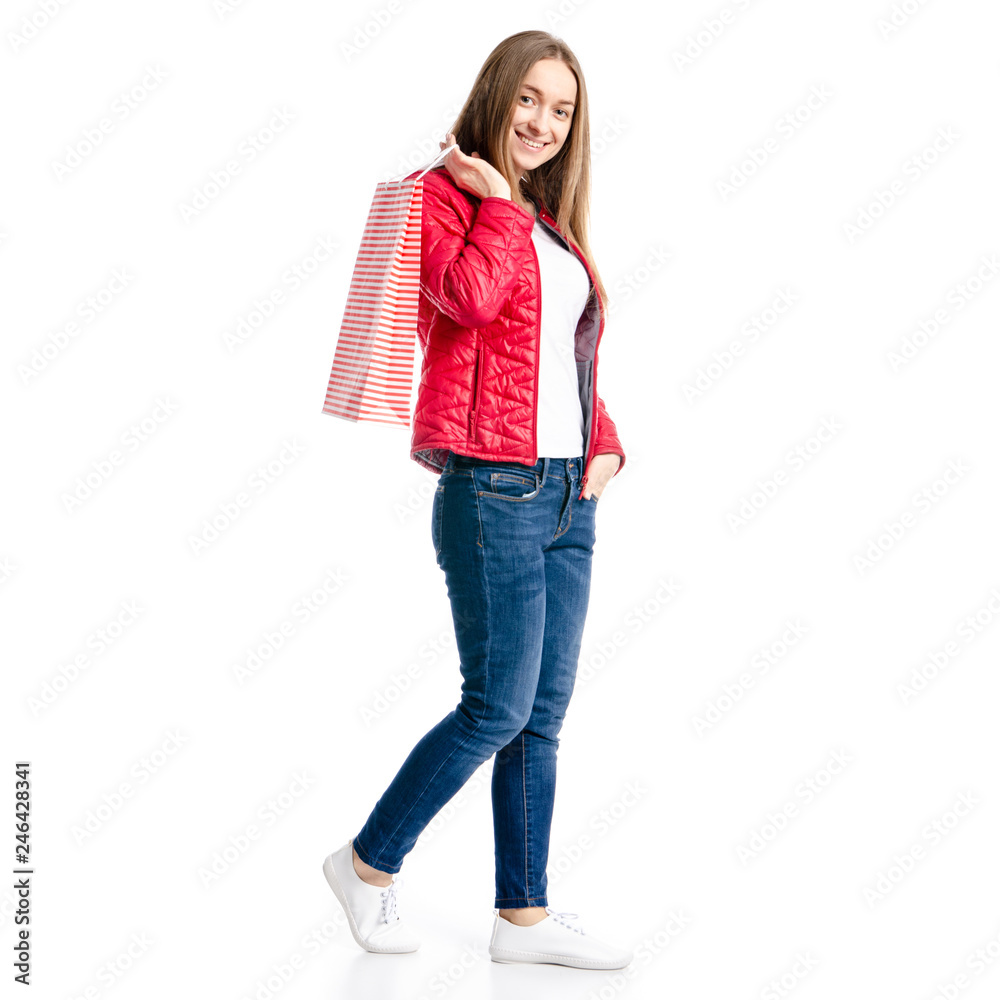 Beautiful woman in jacket and jeans in hand bag package smile goes on white background isolation Beautiful woman in jacket and jeans in hand bag package smile goes on white background isolation