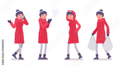 Stylish woman in long red down jacket on a street