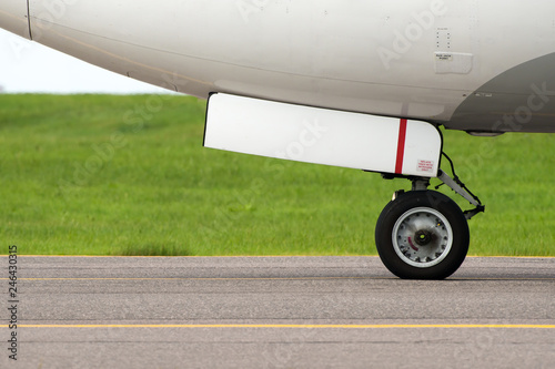 Front landing gear of commercial aircraft closeup hifg detailed view photo