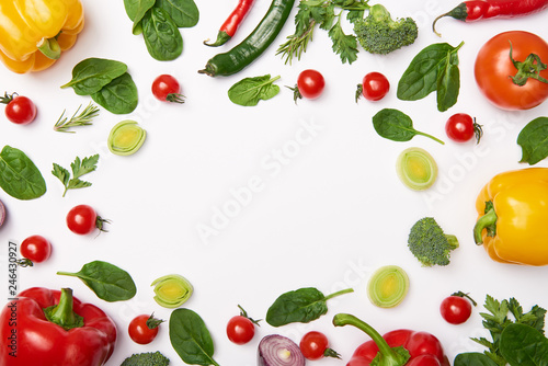 Flat lay with organic vegetables on white background