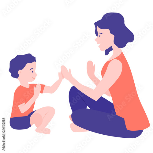 A young mother plays with her growing son. Happy childhood and motherhood. Pat-a-cake, pat-a-cake, baker's man.