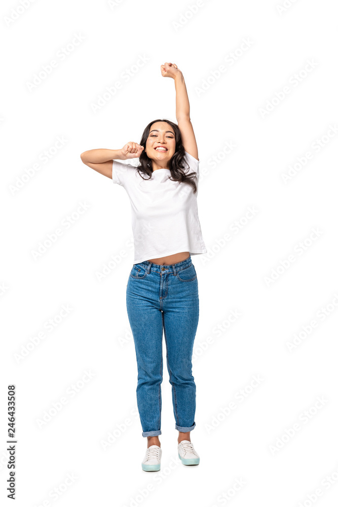 Smiling asian young woman standing with outstretched hand isolated on white Smiling asian young woman standing with outstretched hand isolated on white