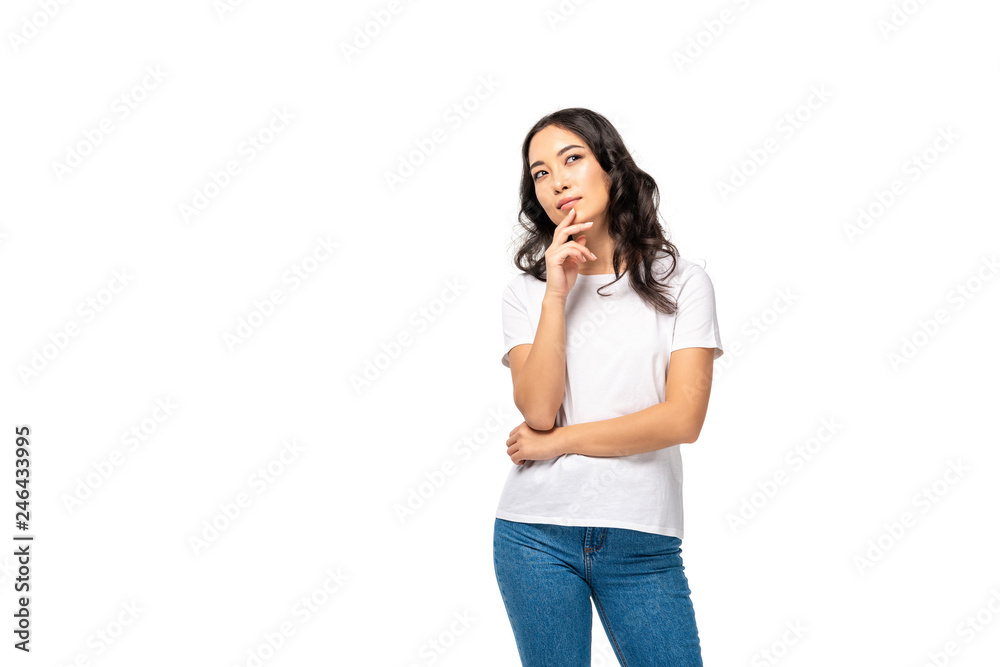 Dreamy pretty asian woman touching chin by hand isolated on white