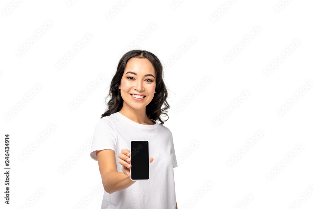 smiling young asian girl showing smartphone with blank screen isolated on white smiling young asian girl showing smartphone with blank screen isolated on white