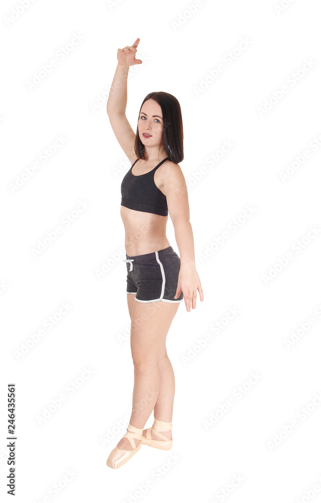 Dancing young woman standing in profile and shorts Dancing young woman standing in profile and shorts