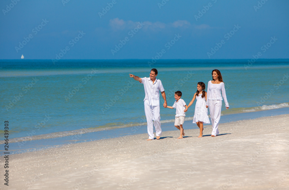 Mother, Father and Children Family Walking on Beach Mother, Father and Children Family Walking on Beach