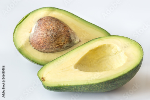 Halved avocado on the white background