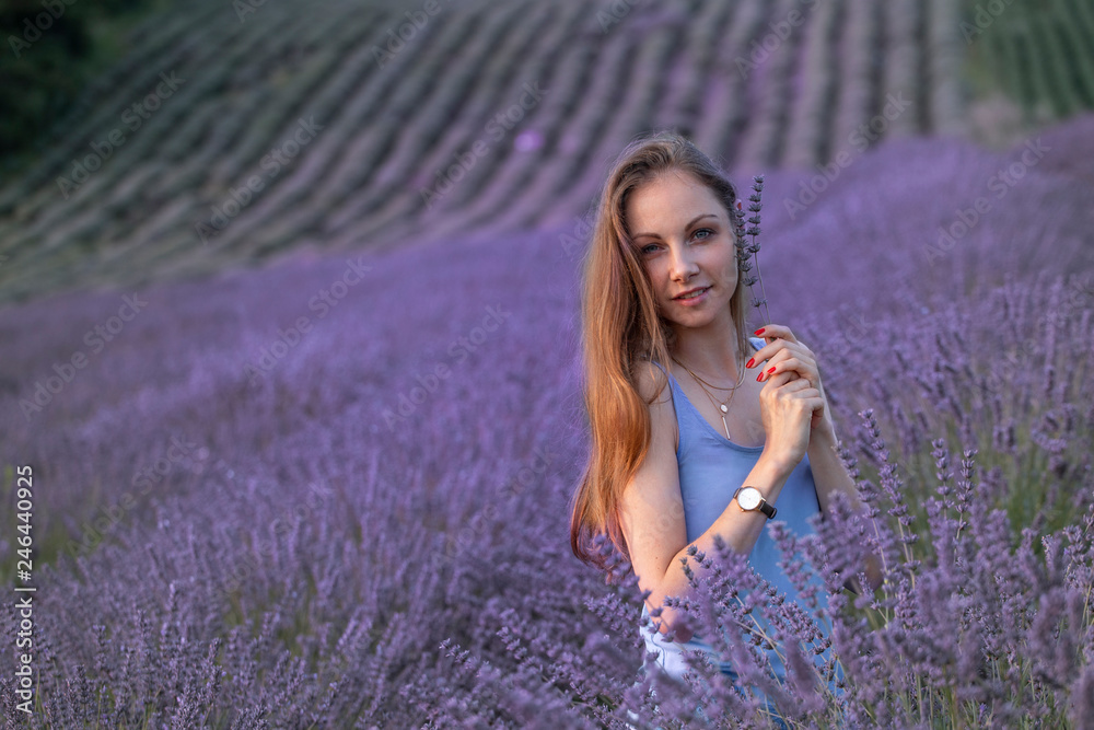 Young long hair beautiful girl standing in the middle of lavanda field Young long hair beautiful girl standing in the middle of lavanda field
