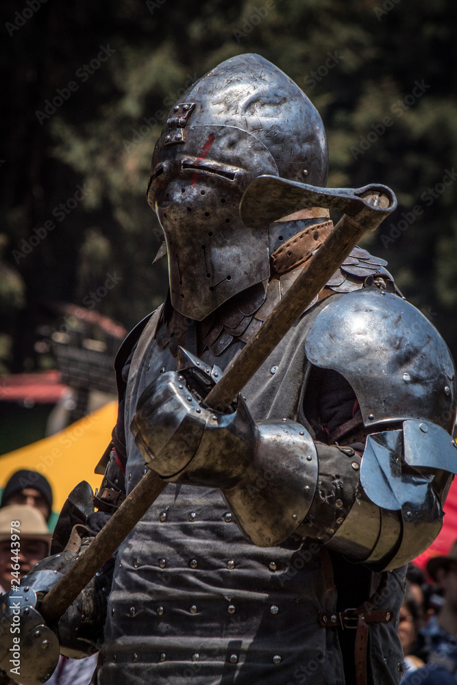 Medieval knights fighting with armor, swords and shields in festival Medieval knights fighting with armor, swords and shields in festival