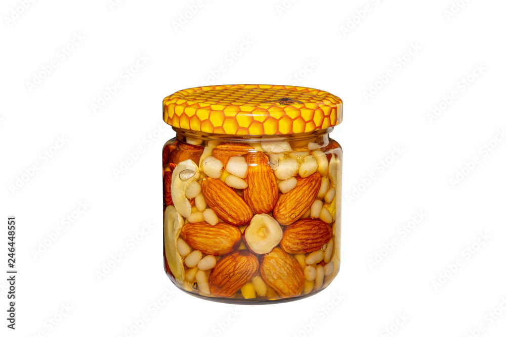 Jar of nuts in honey isolated on white background Stock Photo
