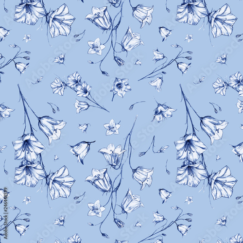 Hand drawn floral seamless pattern background with randomly located graphic bluebell flowers on blue craft paper background